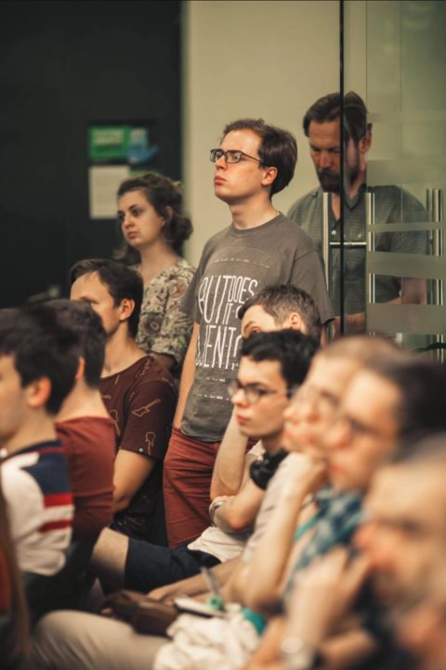Yaroslav standing among a packed audience.